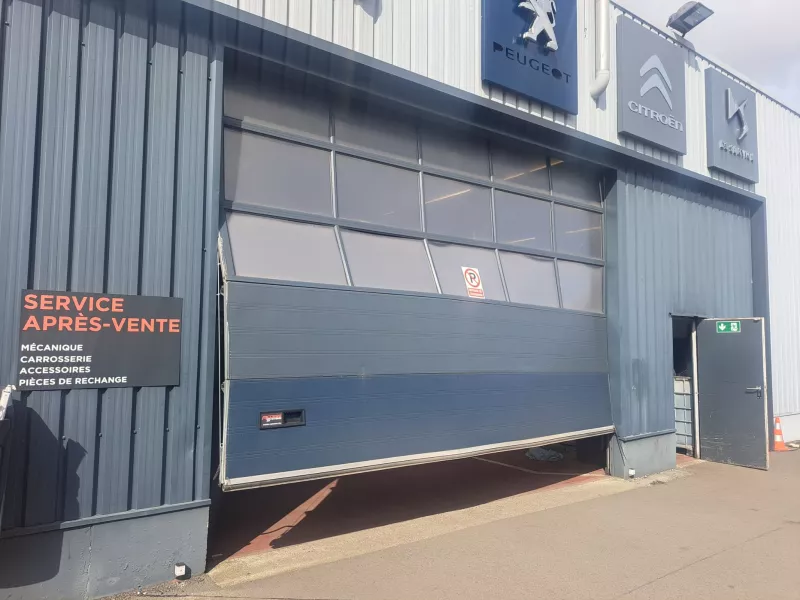 Intervention sur une porte industrielle endommagée chez Citropol à Namur